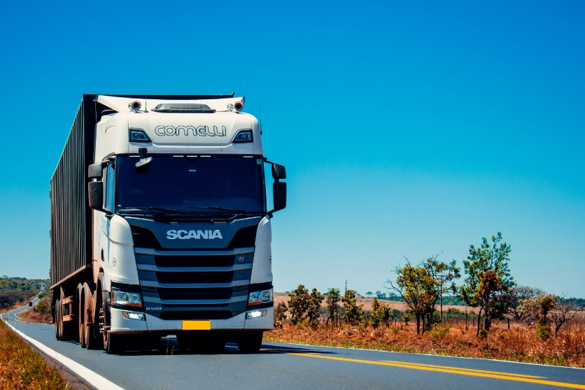 Freight truck transporting cargo along a road